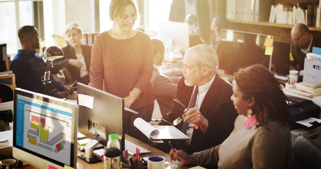 business people gathered around desk